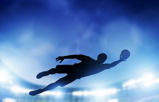 Goalkeeper saving the ball