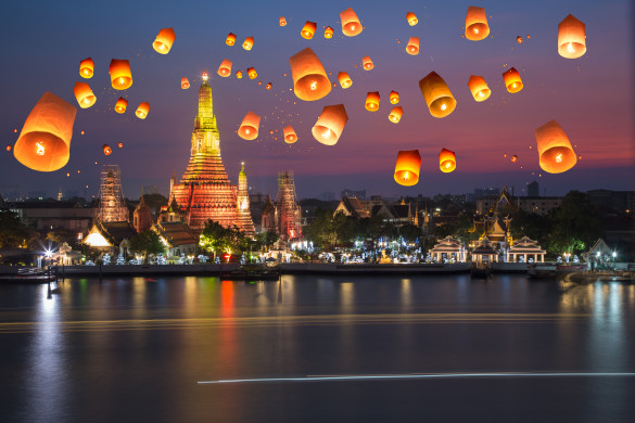 Flying paper lanterns at night