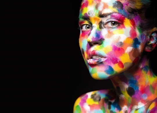 Girl with colored face painted