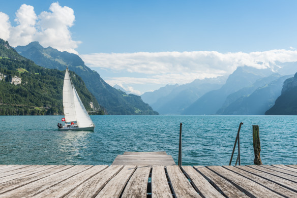 Mountain range in the clouds, view of the lake