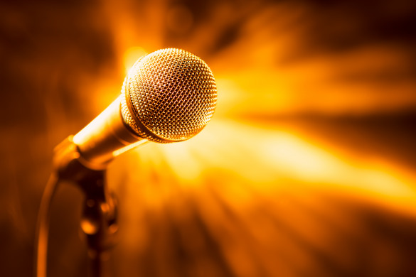 Golden microphone on stage