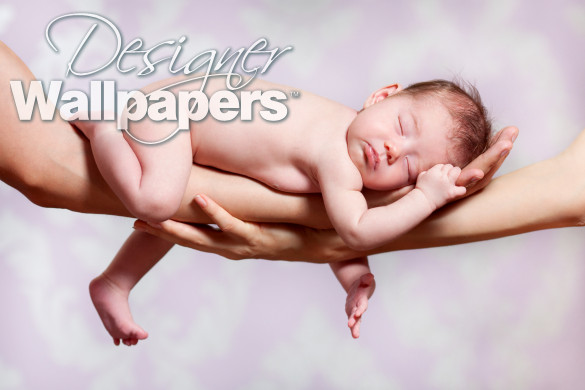 Newborn baby sleeping on parents hands, relax