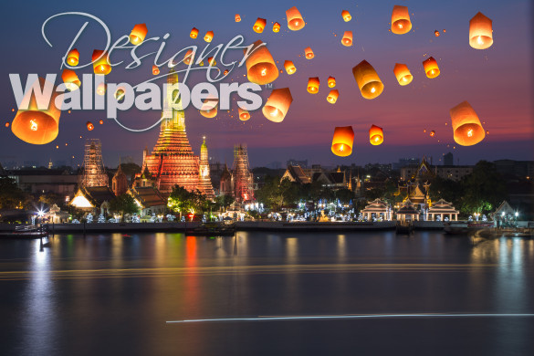 Flying paper lanterns at night