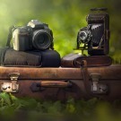 Fotocamera e valigia vintage e reflex