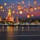 Flying paper lanterns at night