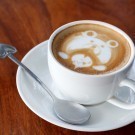 A cup of latte art coffee like face bear