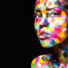 Girl with colored face painted