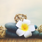 Pebbles and fragipani flower