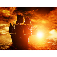 Ancient pirate ship sailing on the ocean at sunset