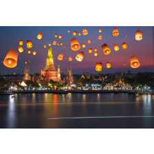 Flying paper lanterns at night