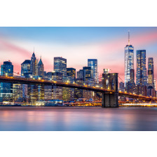 Manhattan skyline under a purple sunset