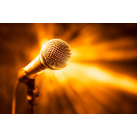 Golden microphone on stage